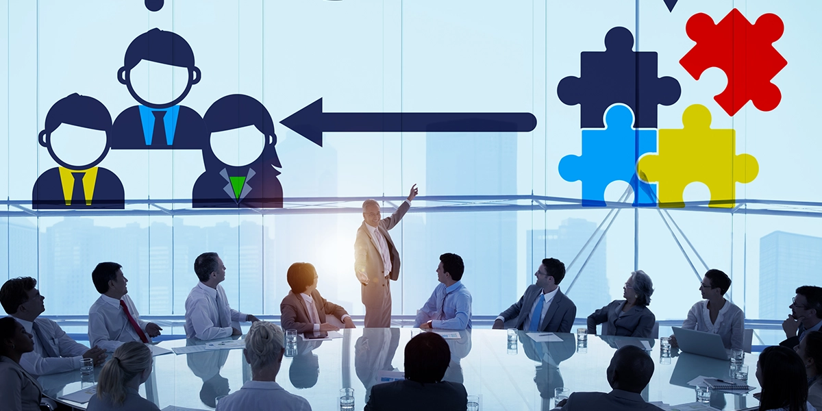 Business meeting with a presenter explaining the advantages and disadvantages of a sole trader business model.