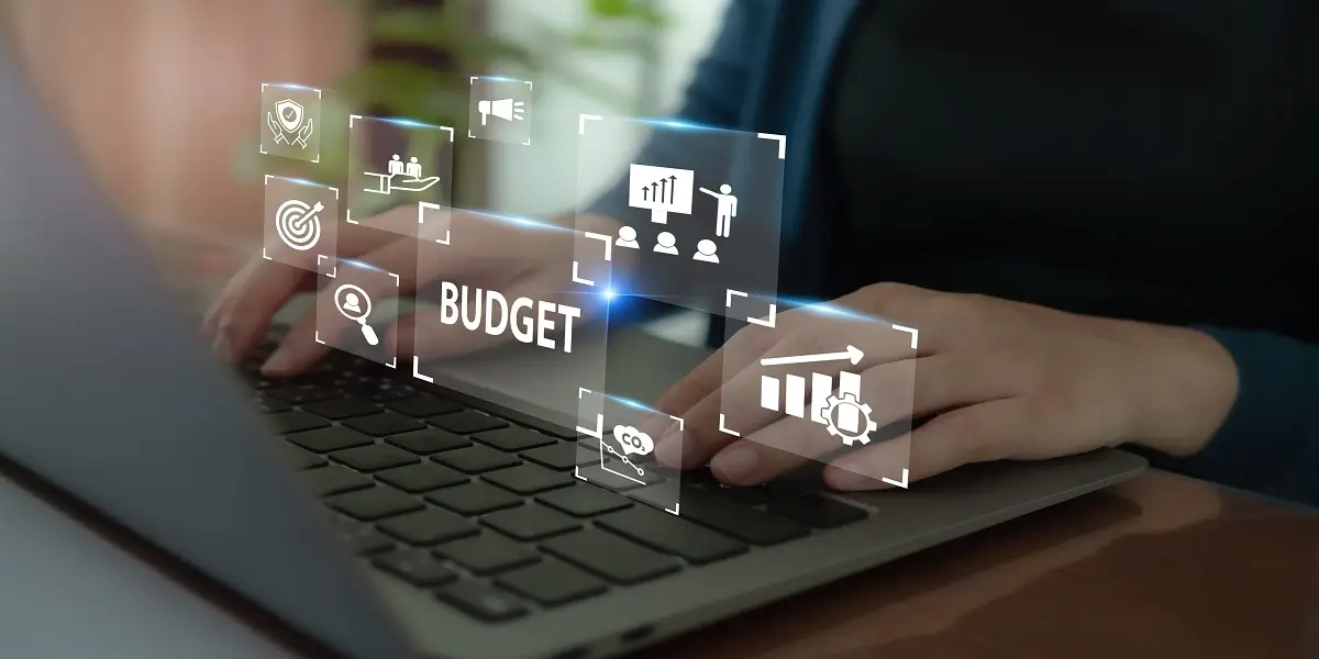Person working on digital planning tools, illustrating the role of technology in Budgeting and Forecasting Strategies.