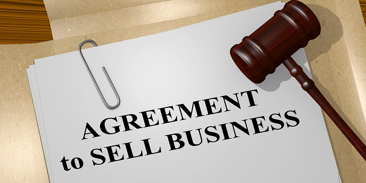 A legal document and gavel symbolising the formal steps required to close or sell a business in the UK properly.