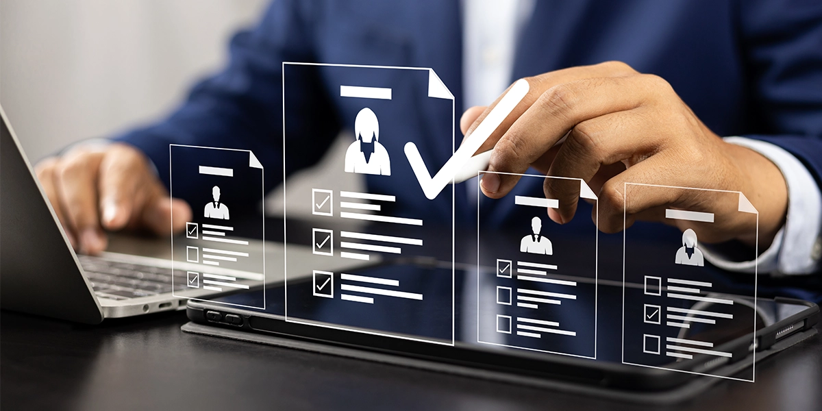 A professional reviewing digital profiles, illustrating virtual CFO debt management strategies for business stability.